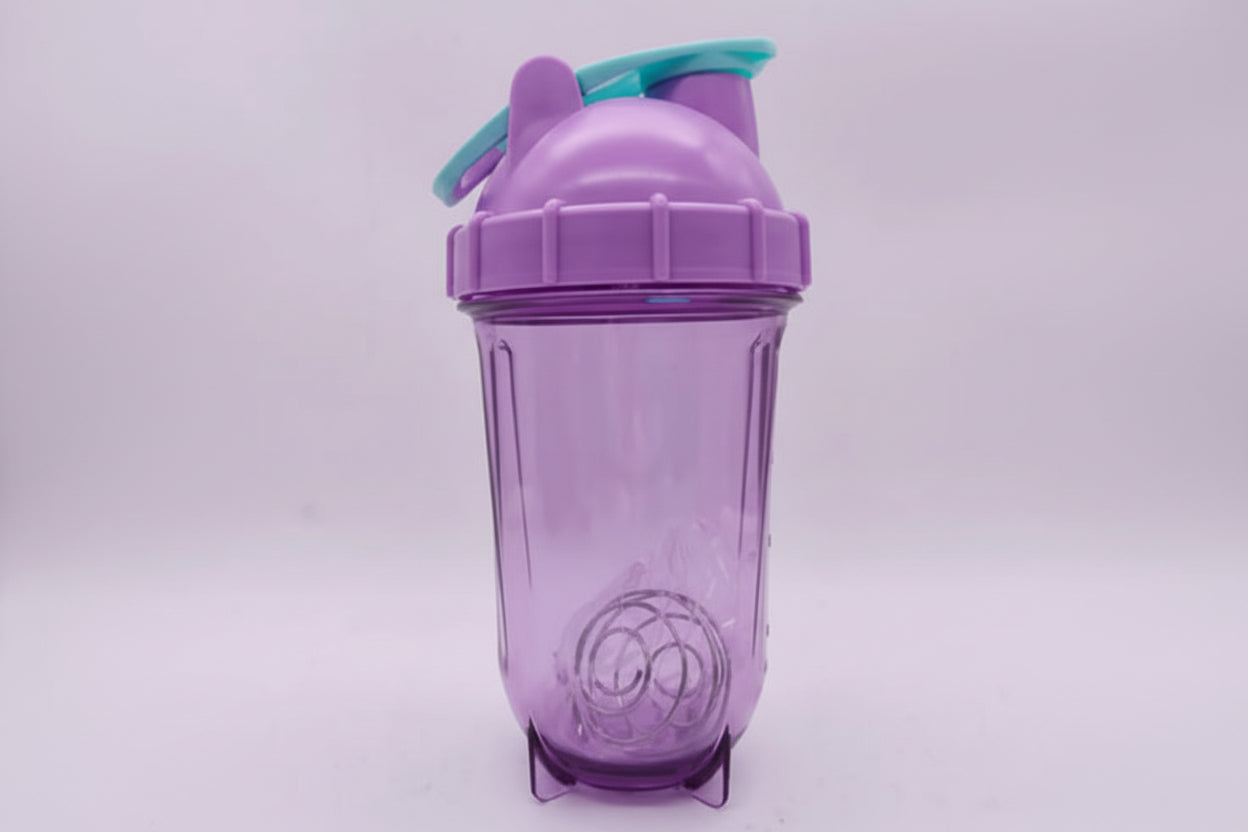 Purple tumbler with a straw on a light purple background