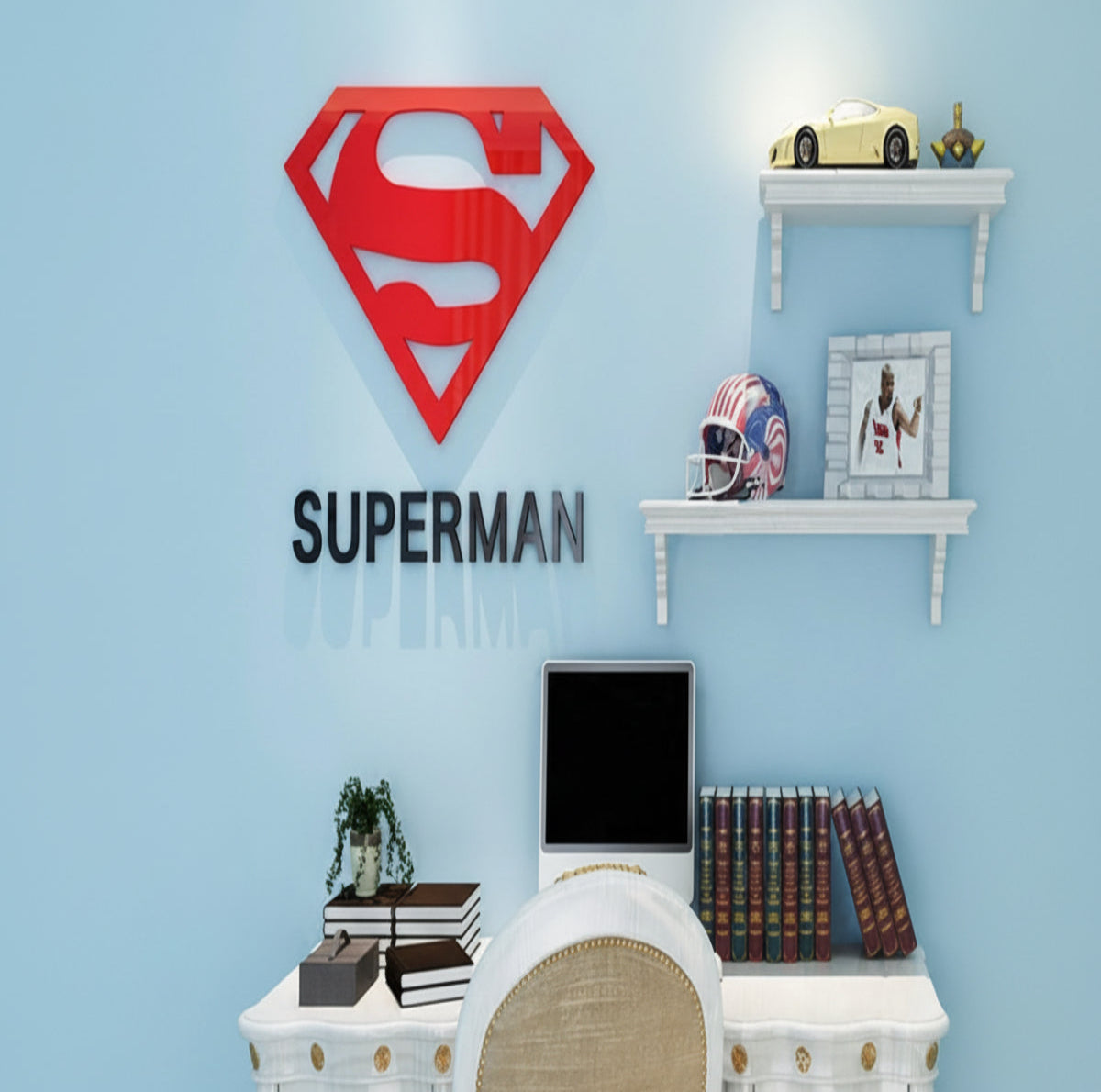 Superman logo wall decal in a room with a desk and books.