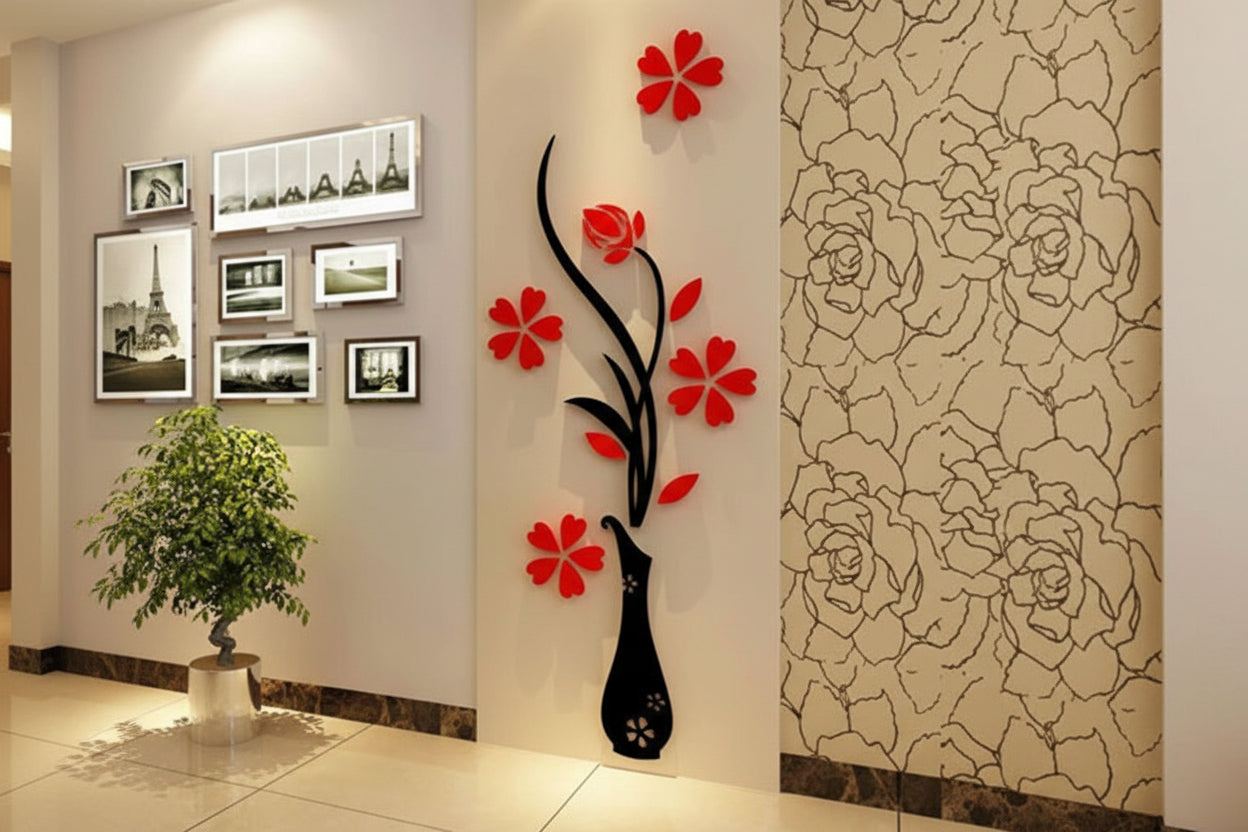 Decorative wall art with red flowers and a black vase on a wall with floral patterns.