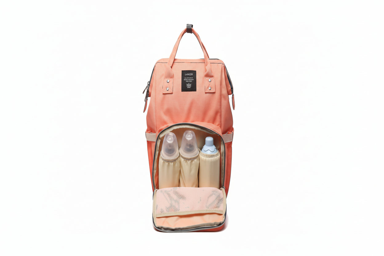 Pink backpack with baby bottles and items inside on a white background