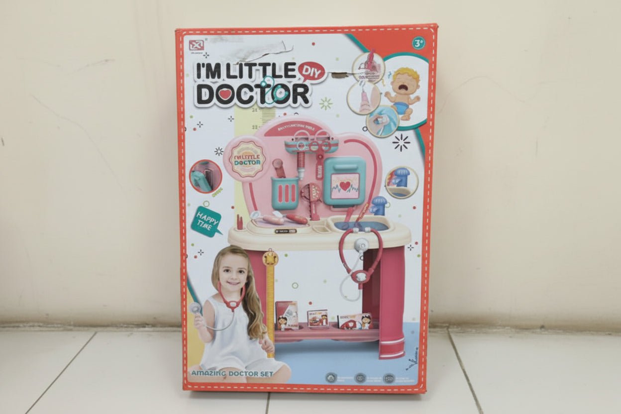 Toy doctor set packaging with colorful design and text on a white surface