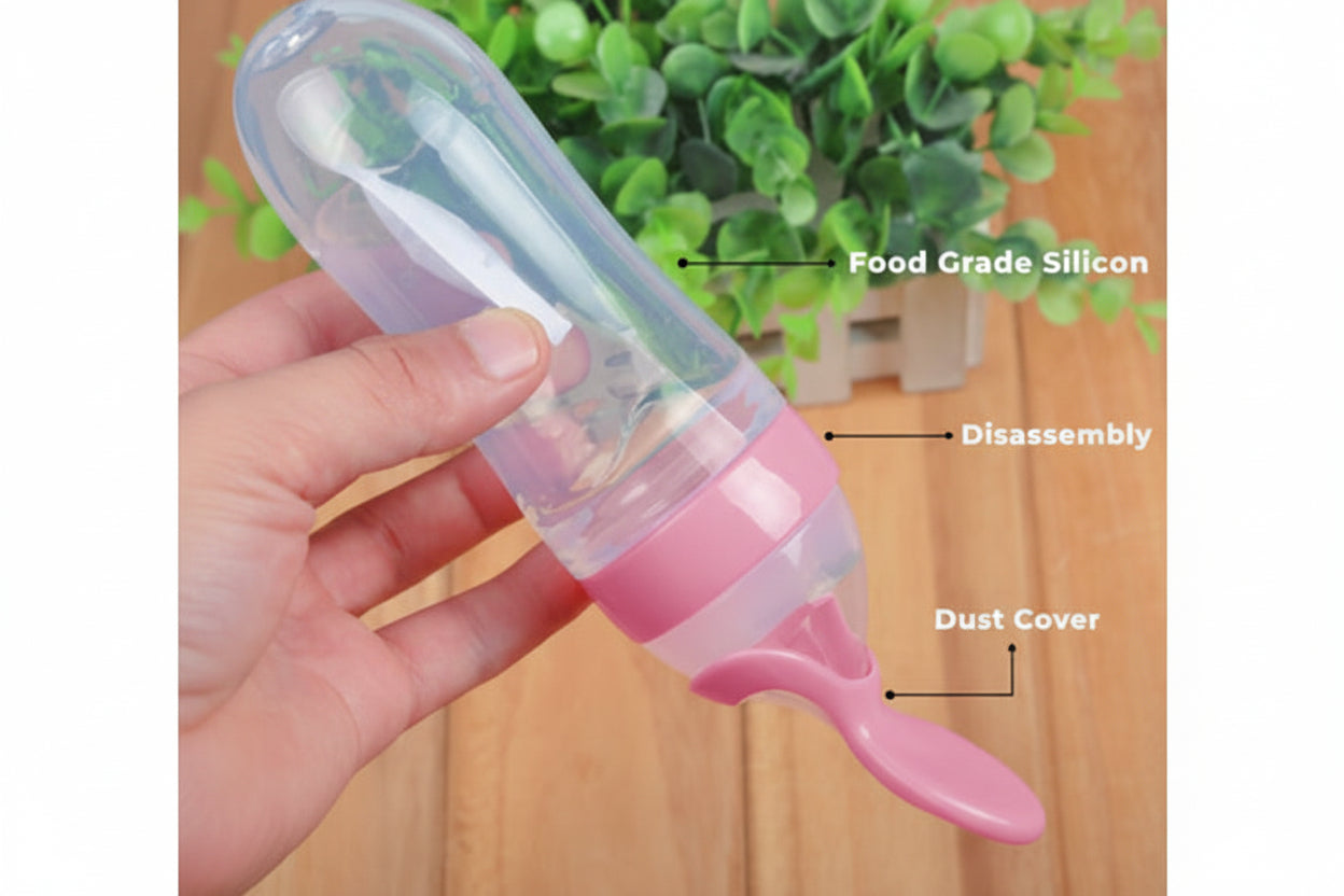 Pink silicone food feeder held by a hand with text indicating 'Food Grade Silicon' and 'Dust Cover'.