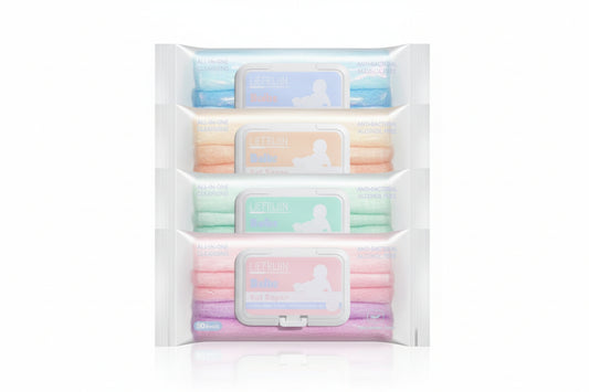 Set of four skincare product packages in a white pouch on a white background