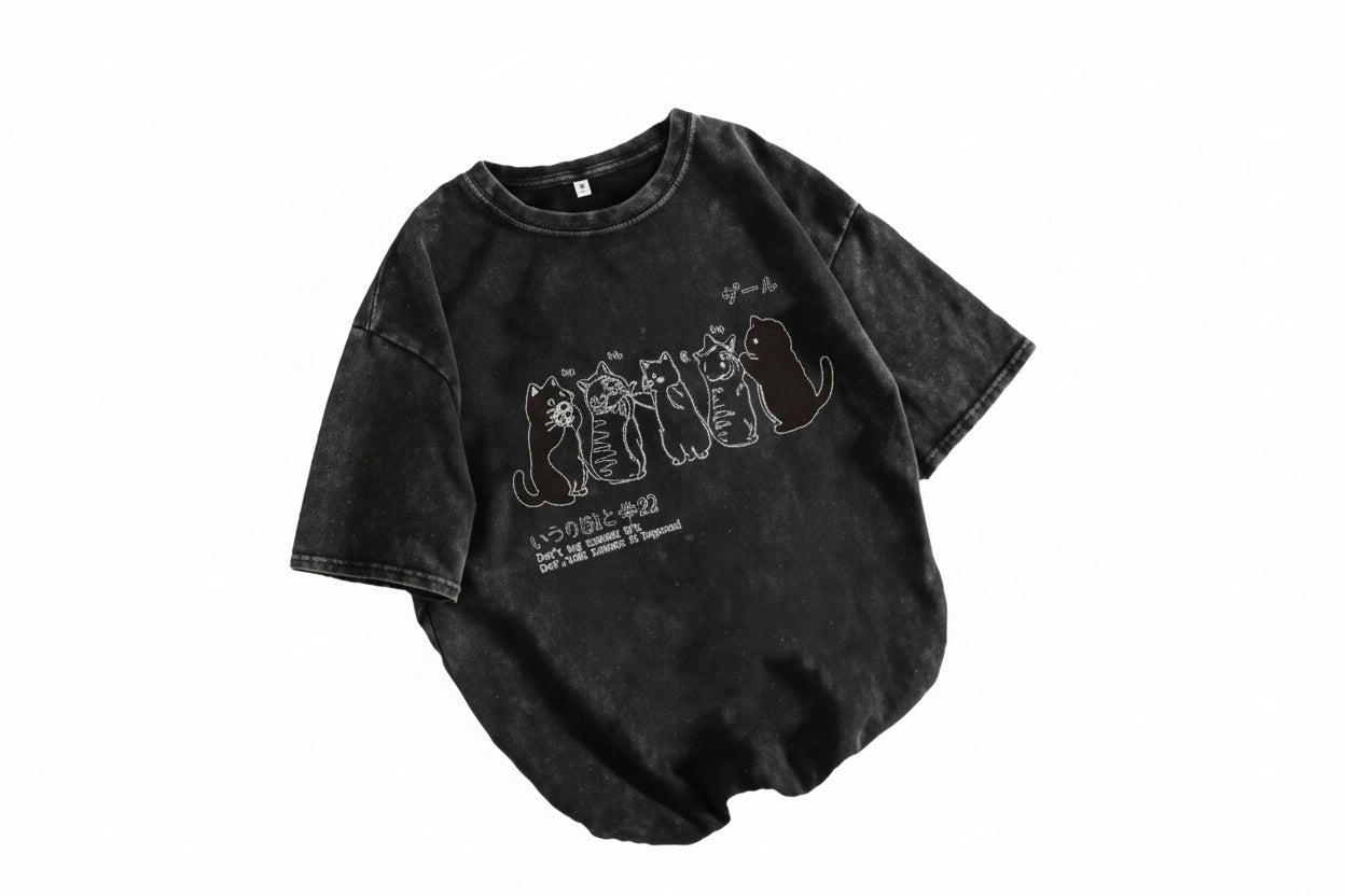 Black t-shirt with white graphic design on a white background