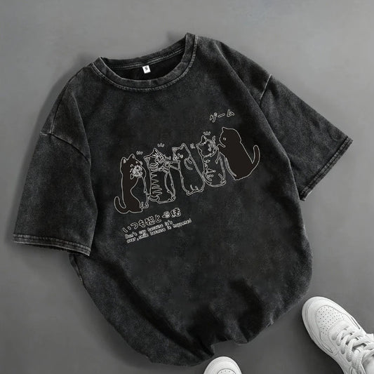 Black t-shirt with cat graphic design on a gray background