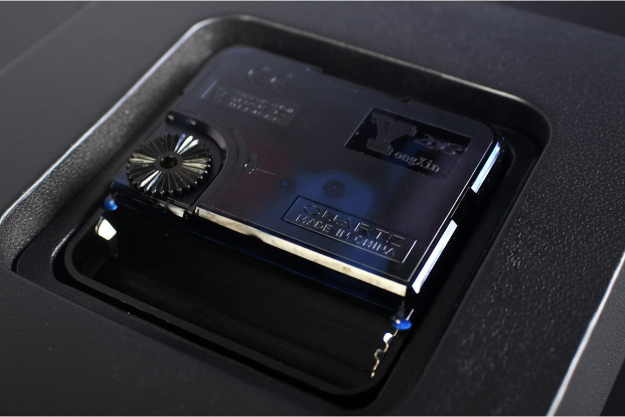 Close-up of a cassette tape with branding on a dark background