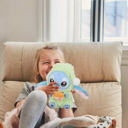 Child holding a plush toy on a couch with a blurred background