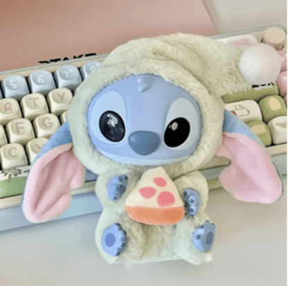 Plush toy resembling a character with a keyboard in the background