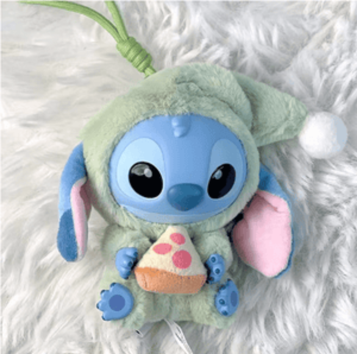 Plush toy resembling a character from an animated movie on a fluffy white surface