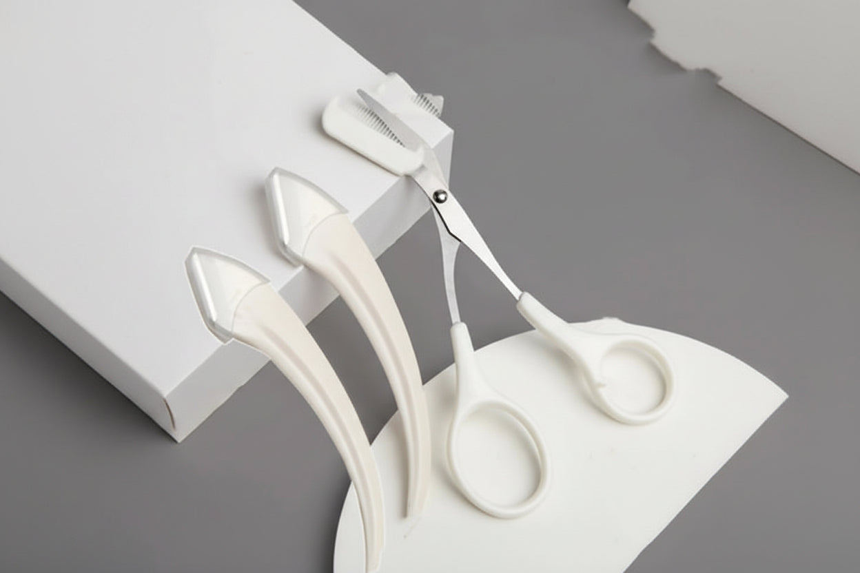 White scissors and hair clips on a gray background