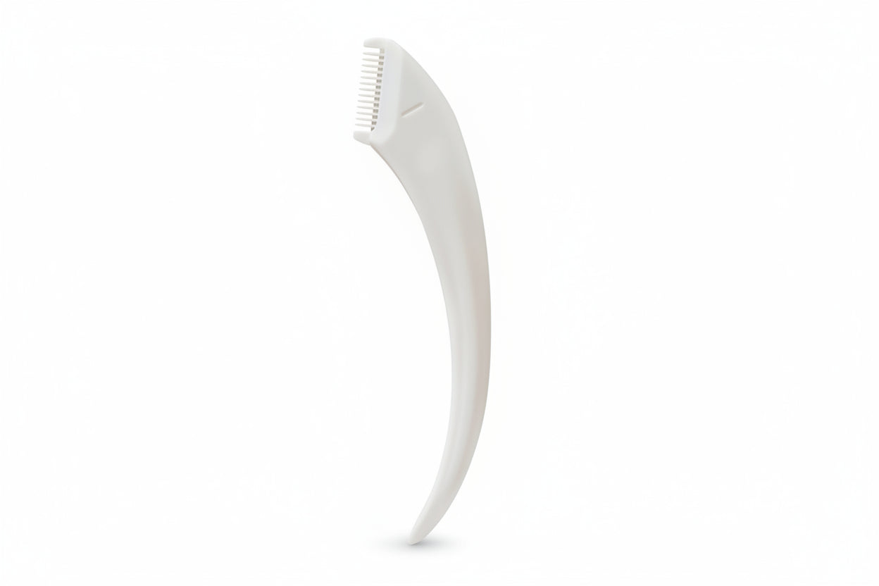 White dog grooming tool on a white background