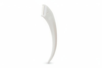 White dog grooming tool on a white background