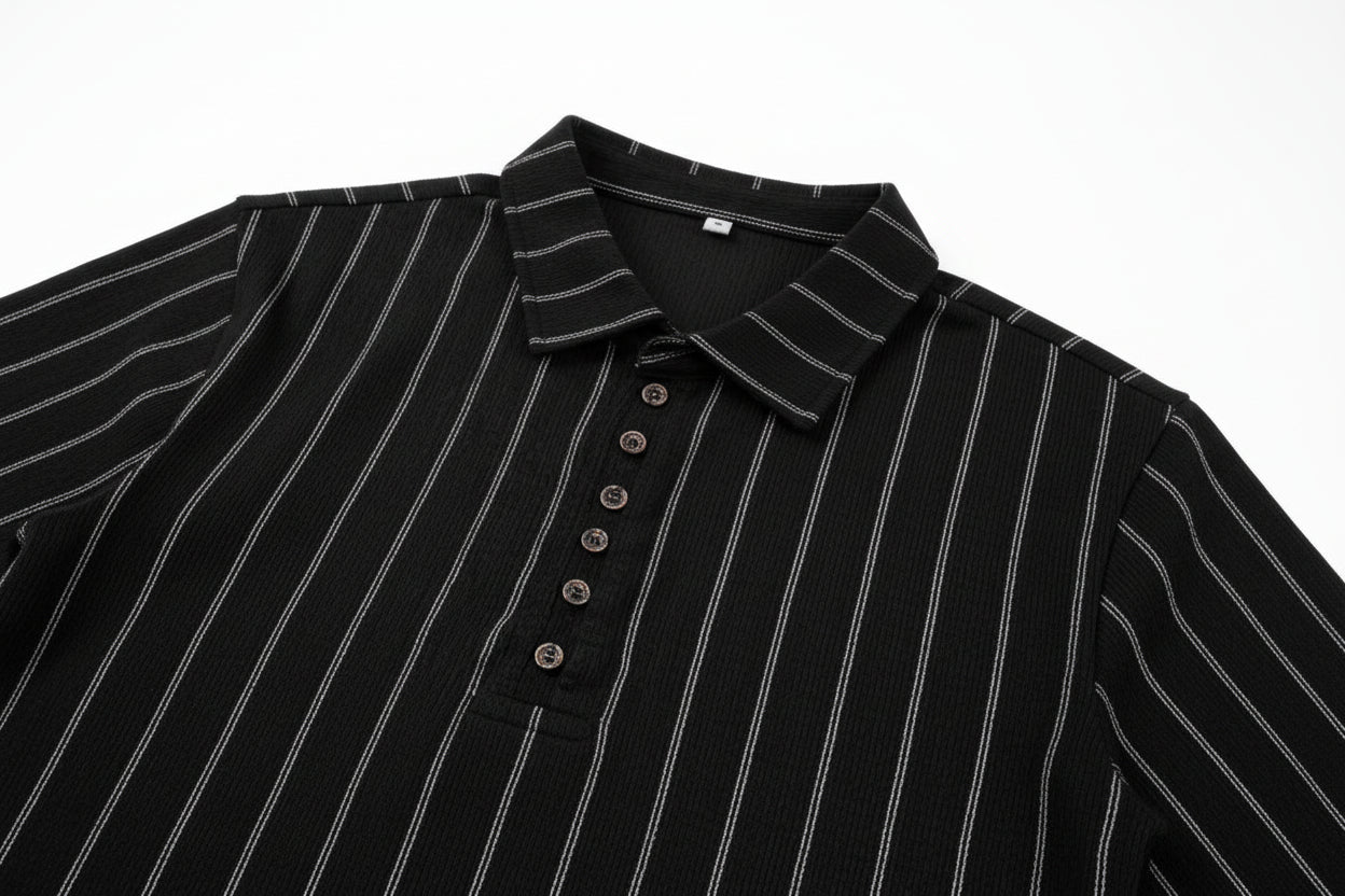 Close-up of a black pinstripe shirt with buttons on a white background