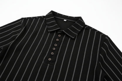 Close-up of a black pinstripe shirt with buttons on a white background