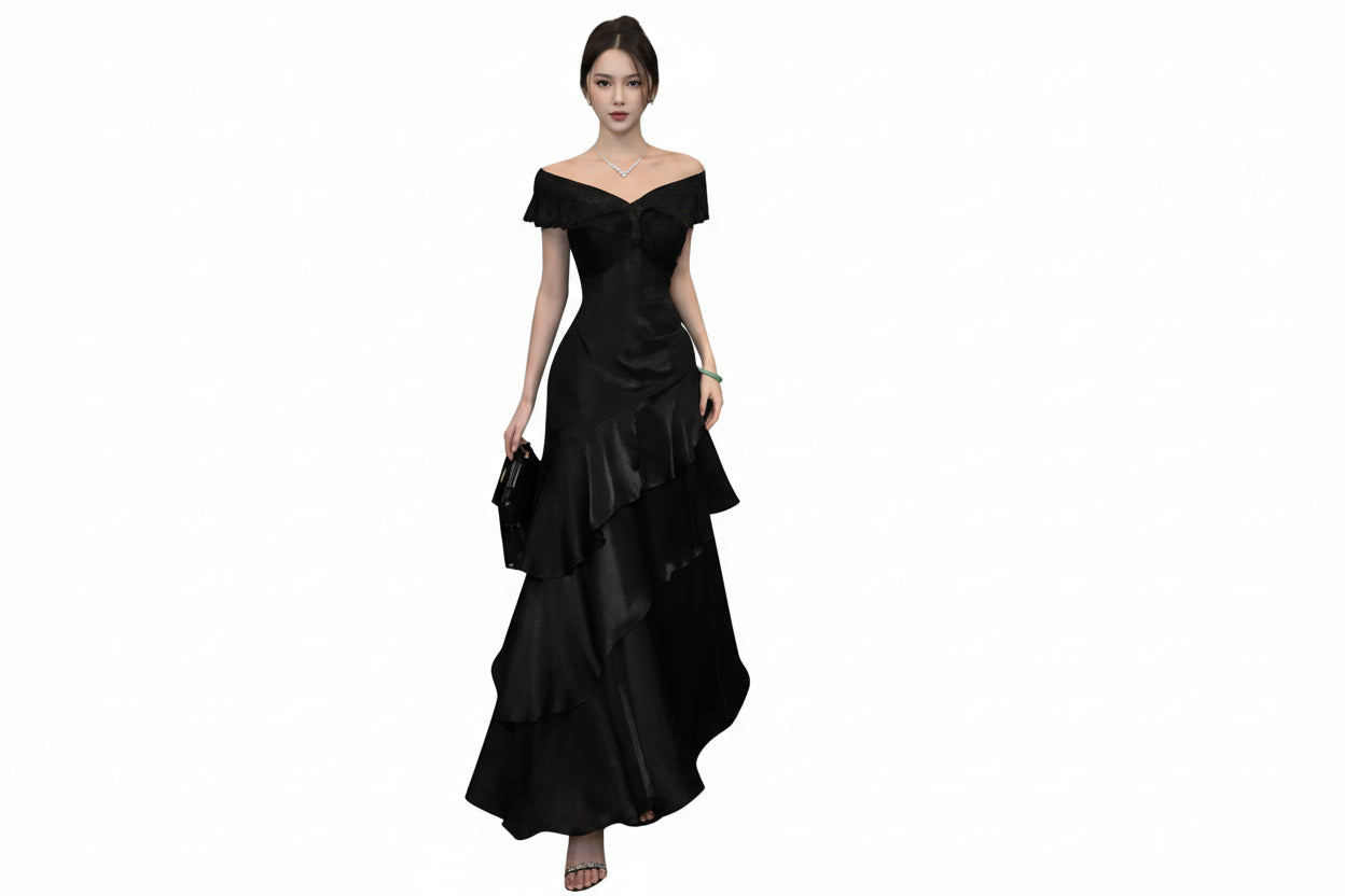 Woman wearing a black off-shoulder dress on a white background