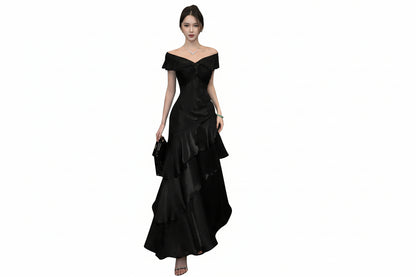 Woman wearing a black off-shoulder dress on a white background