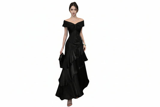 Woman wearing a black off-shoulder dress on a white background