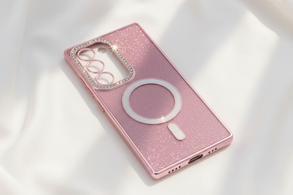 Pink phone case with metallic accents on a beige background