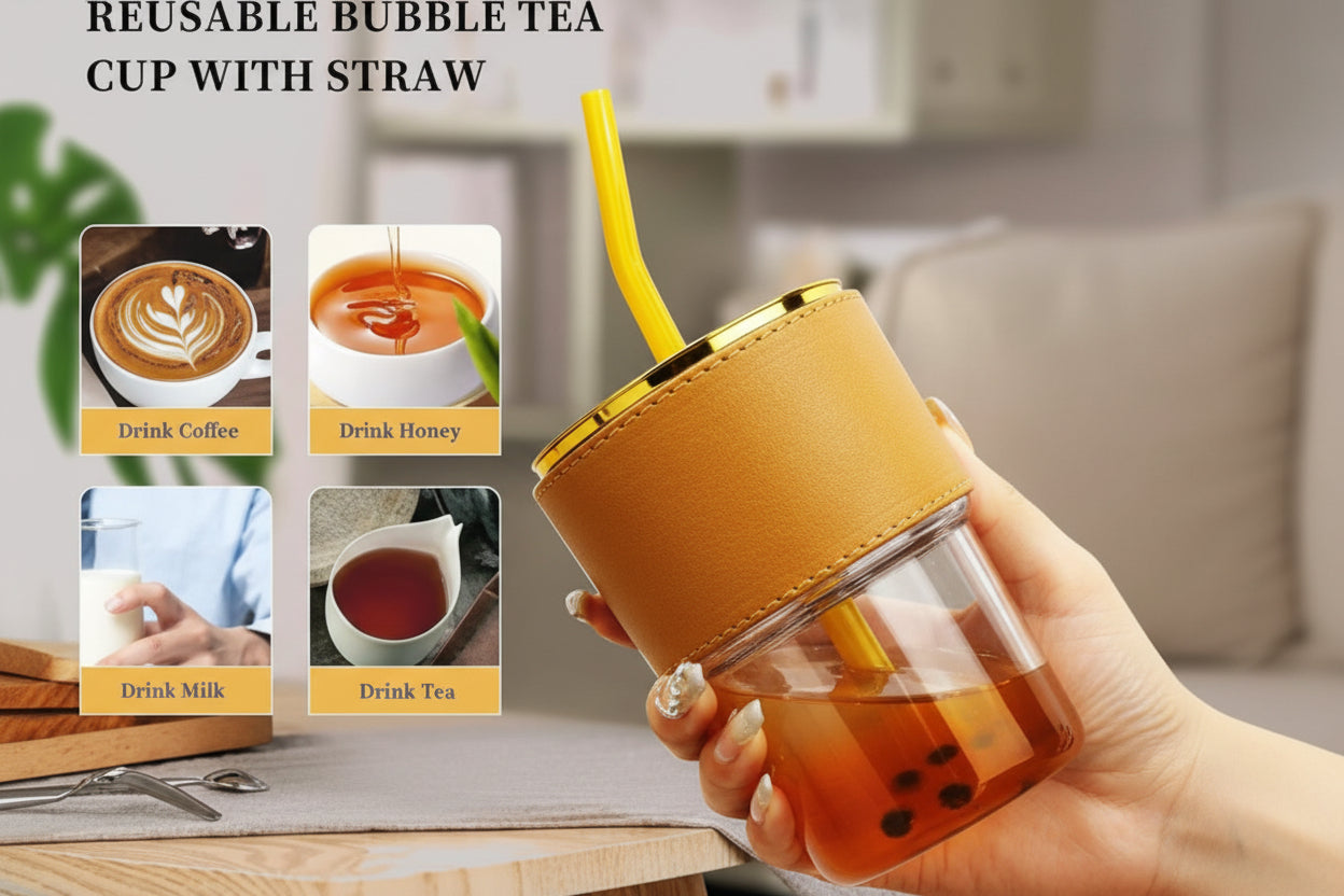 Reusable bubble tea cup with straw held by a hand, with images of drinks on a wooden surface.