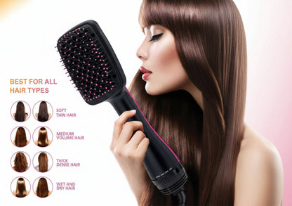 Hairbrush with text indicating suitability for all hair types, held by a person with styled hair.