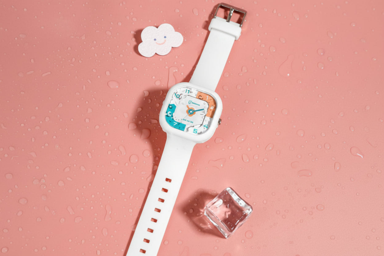 White watch with a colorful face on a pink textured background