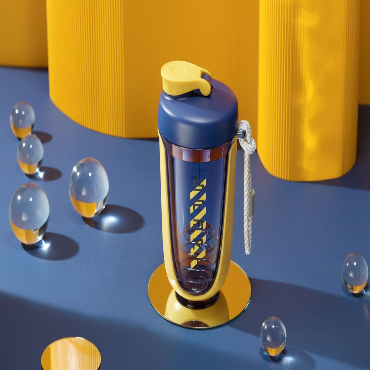 Blue and yellow water bottle with a keychain on a blue surface with yellow cylindrical objects in the background.