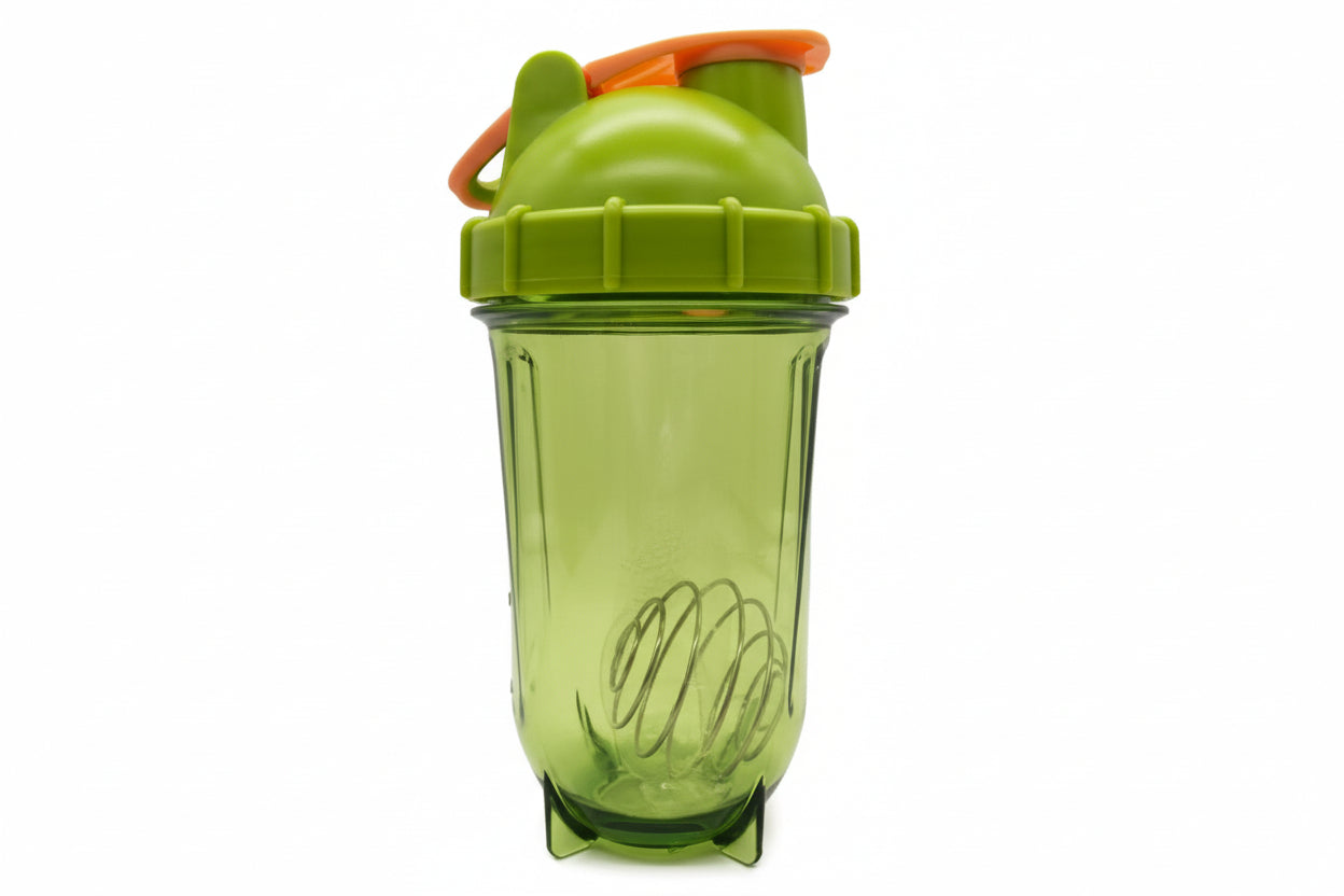 Green tumbler with a lid on a white background