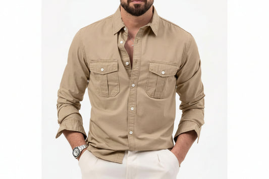 Man wearing a beige button-up shirt with rolled-up sleeves on a white background