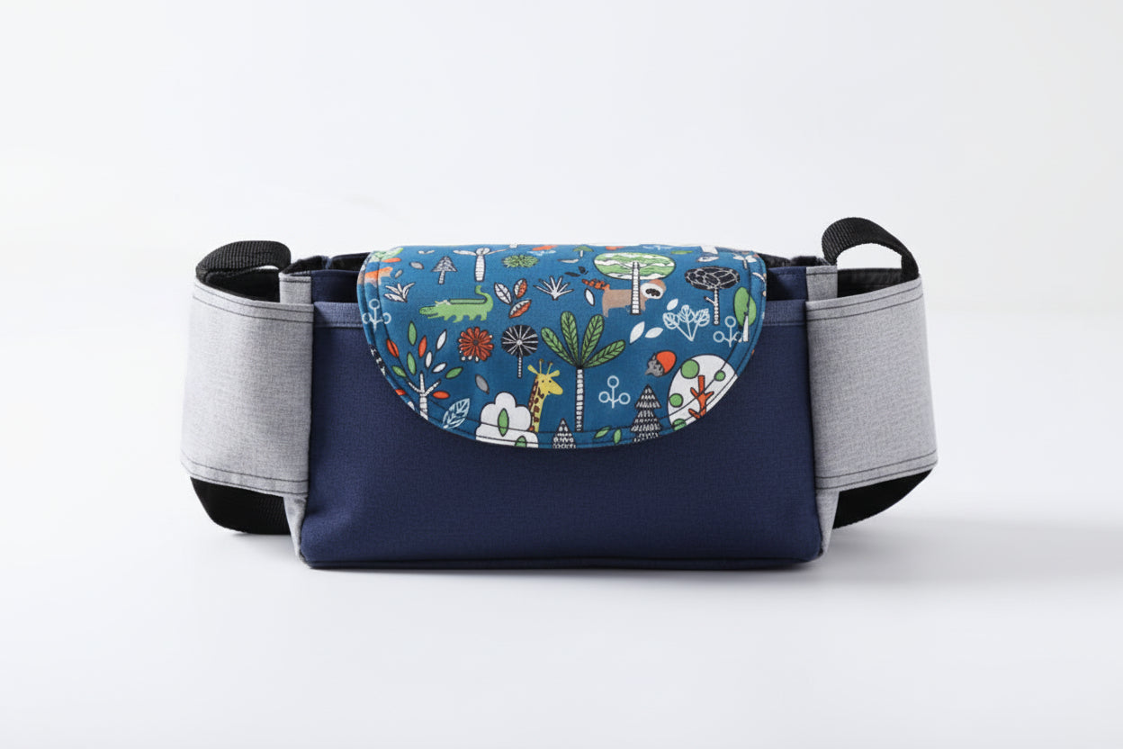 Blue pet carrier with colorful animal pattern on a white background