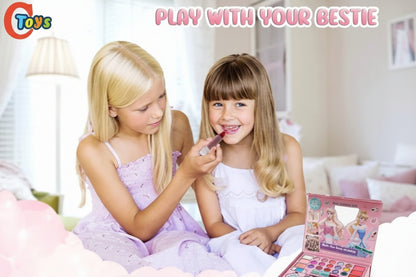 Two young girls playing with a toy makeup set in a room.
