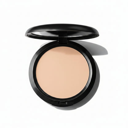 Compact powder in a black case on a white background