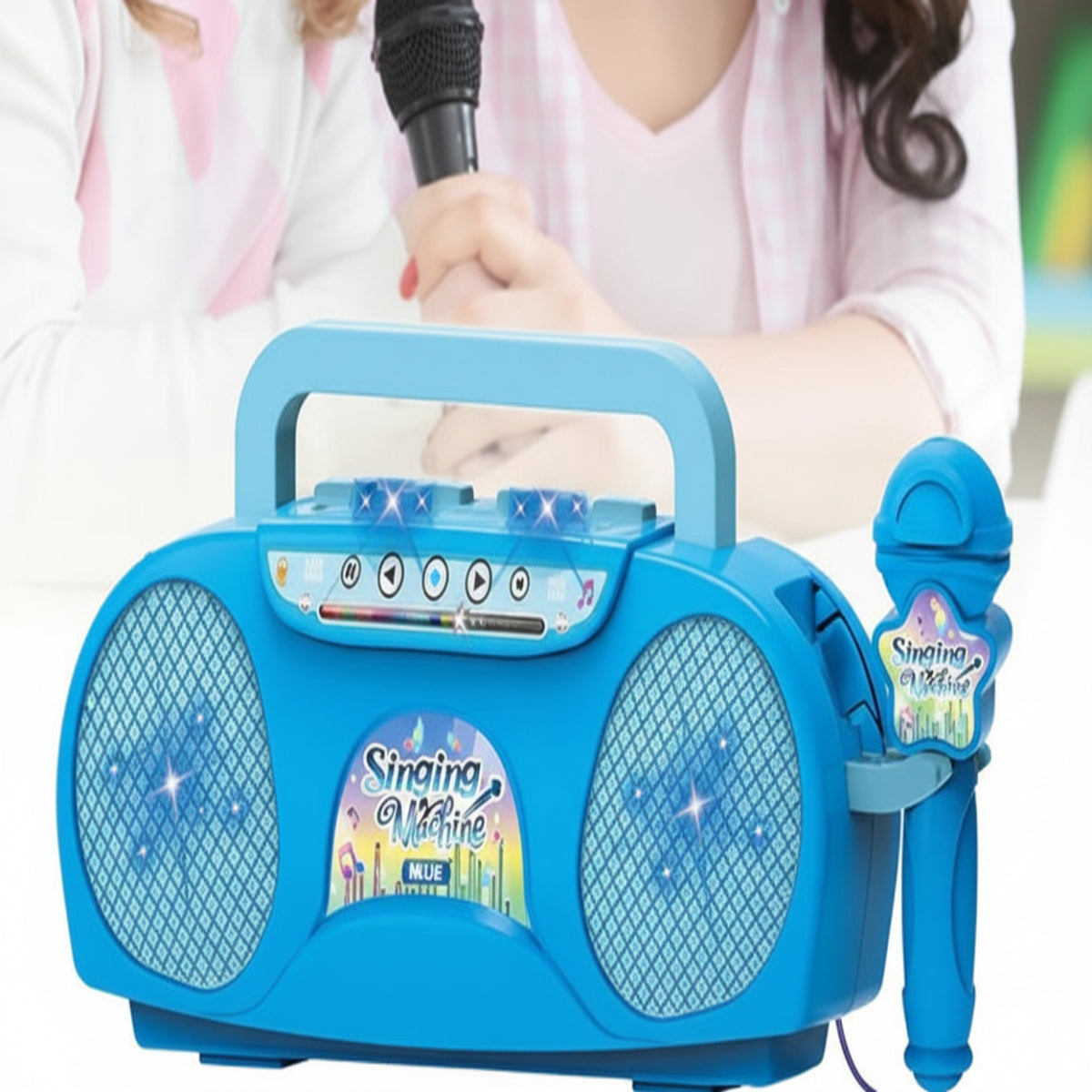 Children playing with a blue karaoke machine and microphone