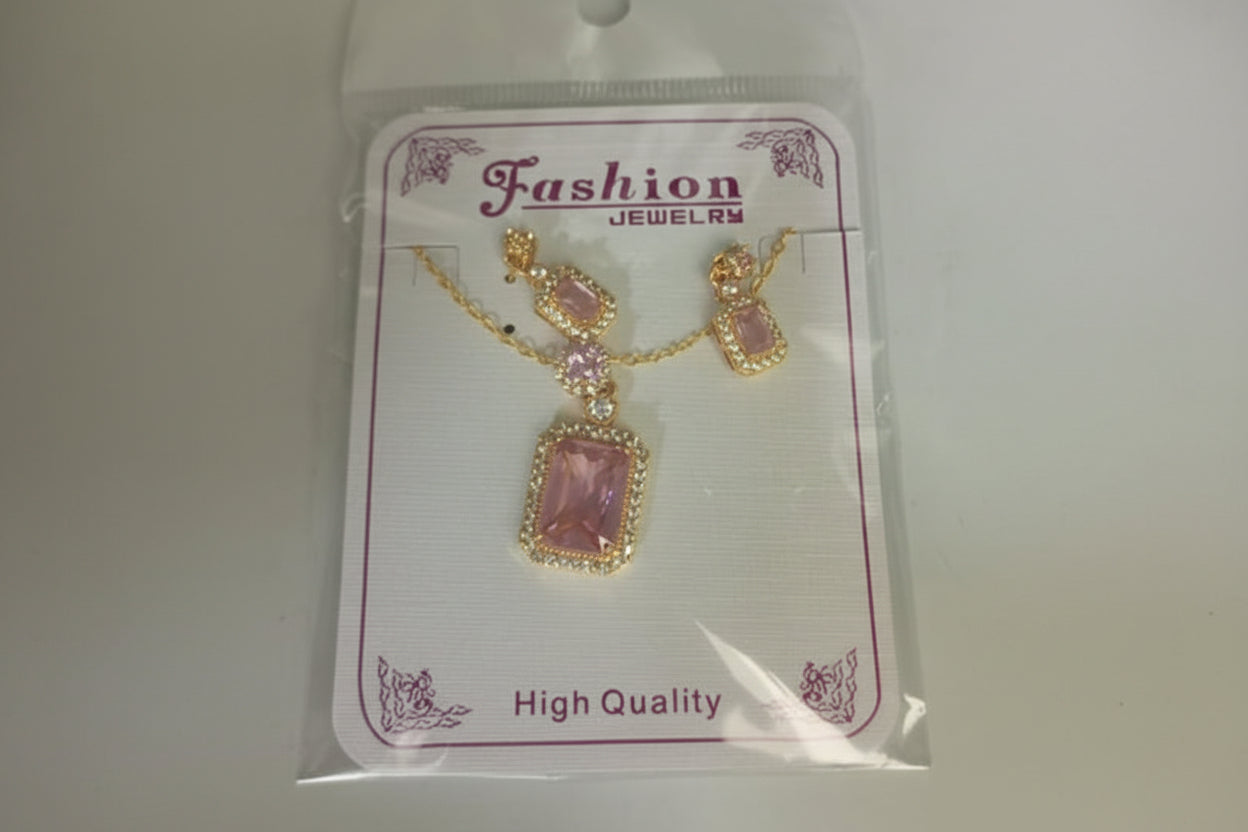 Jewelry set with pink pendant and gold accents on a 'Fashion Jewelry' card.