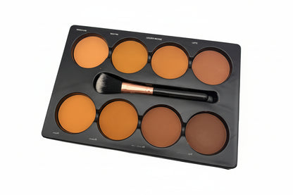 Makeup palette with brown shades and a brush on a white background