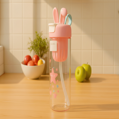 Pink and clear tumbler with a straw on a wooden surface
