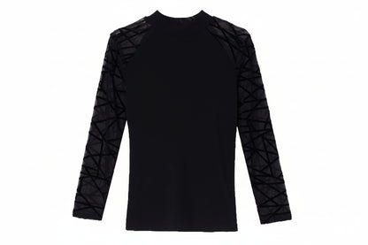 Black long-sleeve top with geometric cutouts on sleeves against a white background