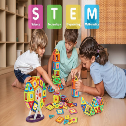 Children playing with colorful magnetic building blocks on a wooden table, with 'STEM' education labels above them.