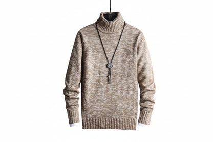 Beige turtleneck sweater with a necklace on a white background