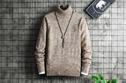 Beige turtleneck sweater with a necklace on a grid background