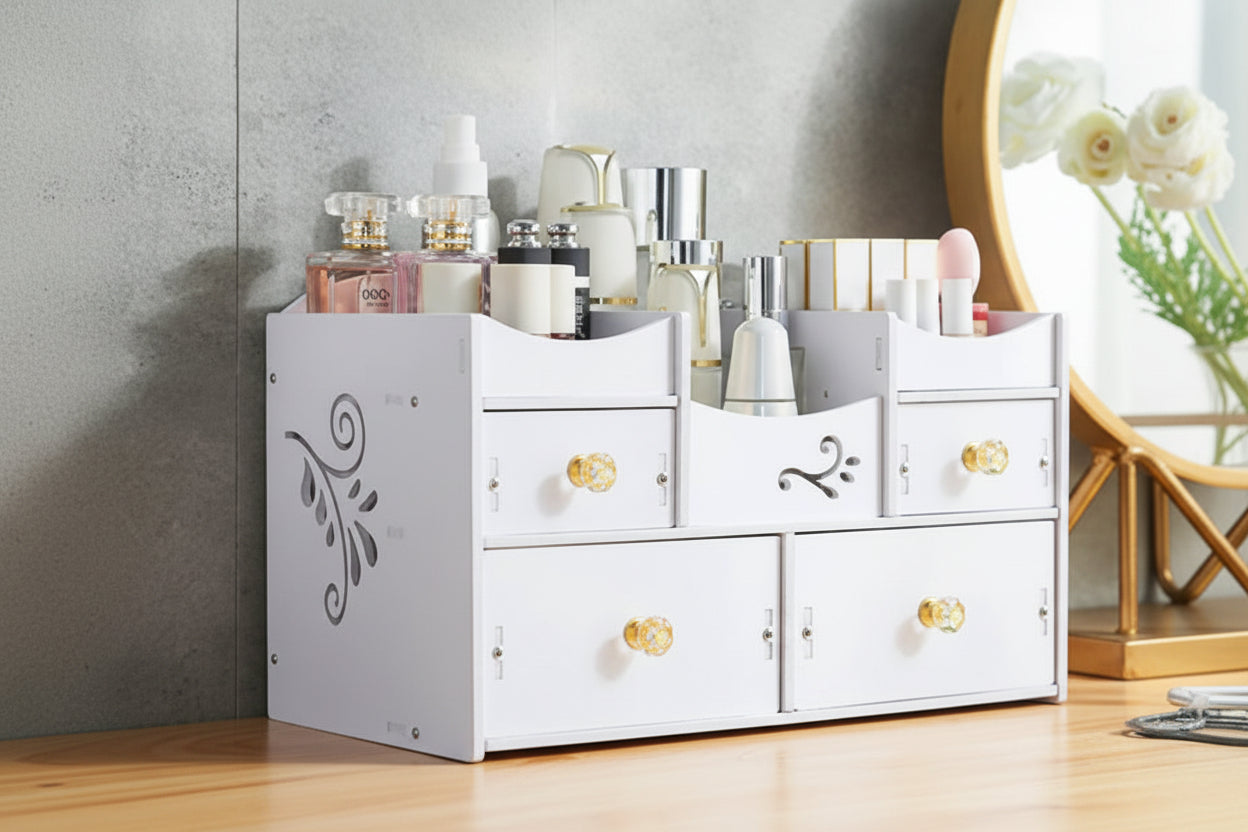 White cosmetic organizer with gold knobs holding various beauty products against a neutral wall.